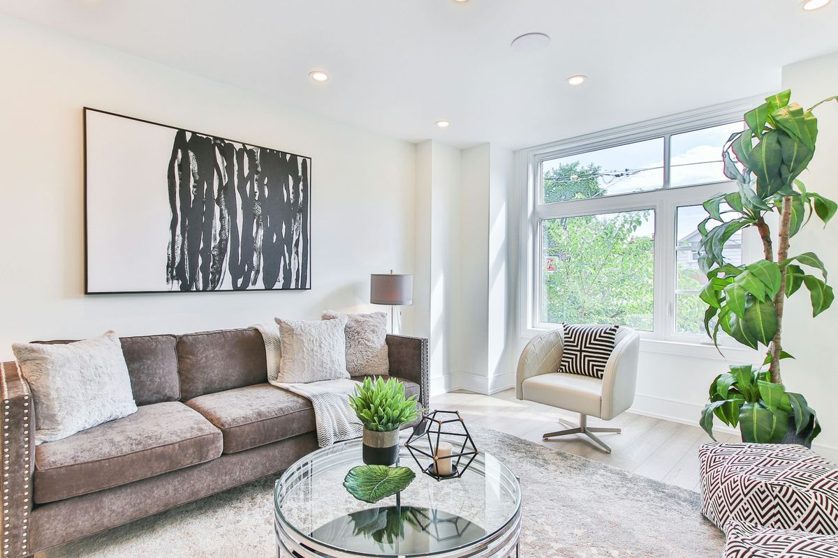 Bright, freshly cleaned living room with natural light and plants
