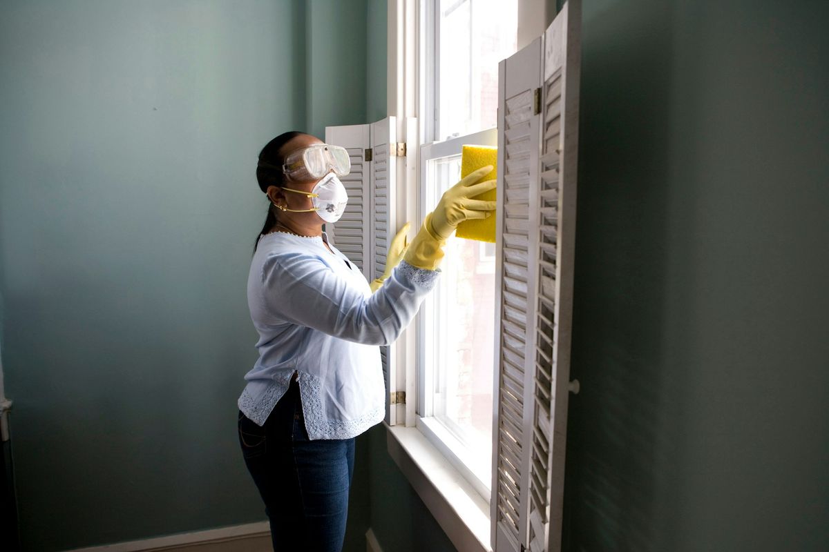 Cleaning interior window glass and frames by hand